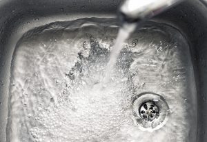 tapwater-down-metal-sink