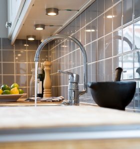 kitchen-faucet-pouring-water